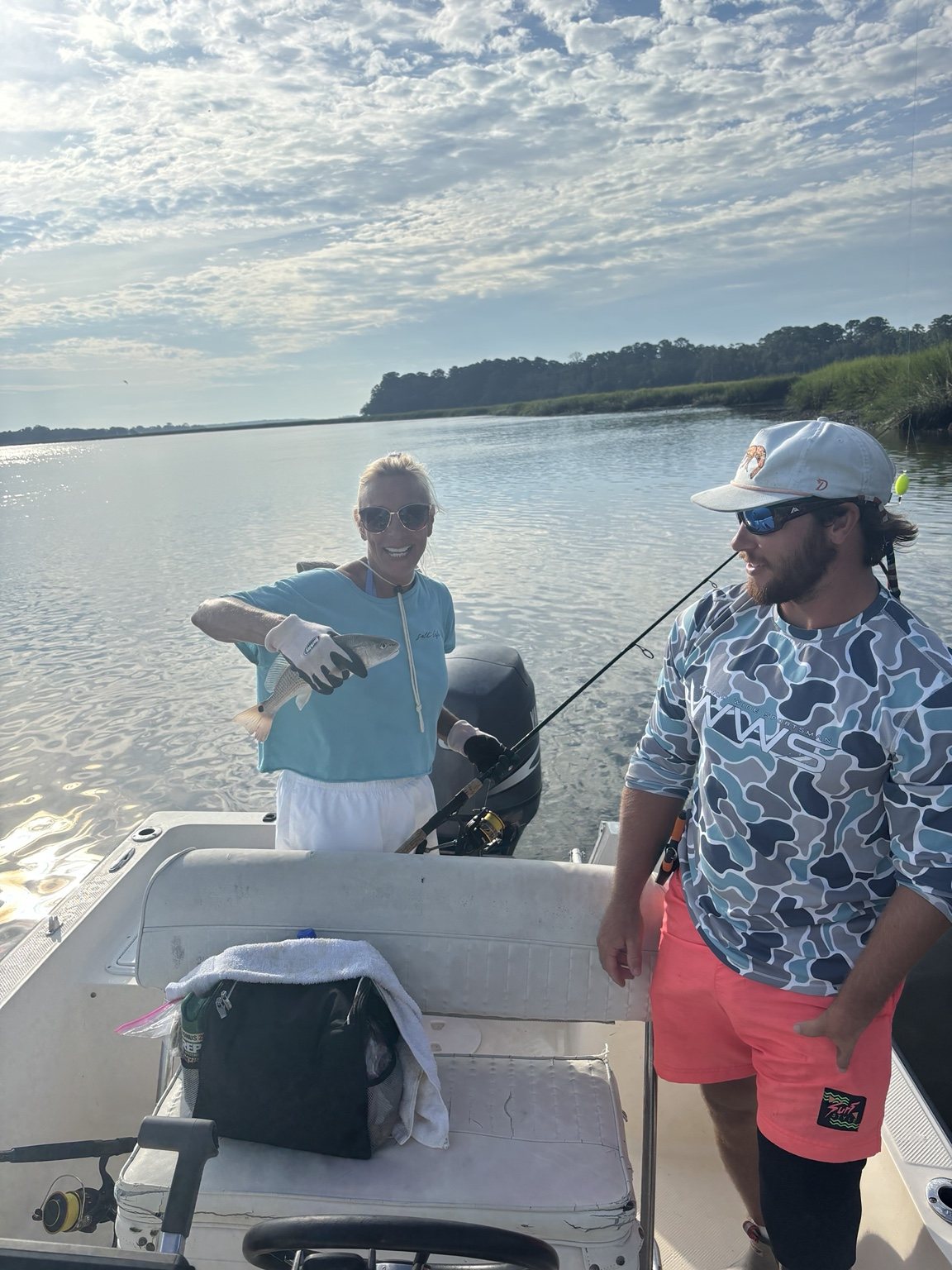 Skippers Charters client holding a redfish on the Georgia coast